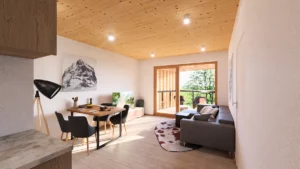 Innenansicht einer Wohnung im Projekt Piesendorf mit Holzsichtdecke und Sicht auf den Balkon